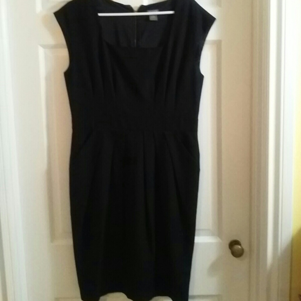 Beautiful form fitting mid length work dress